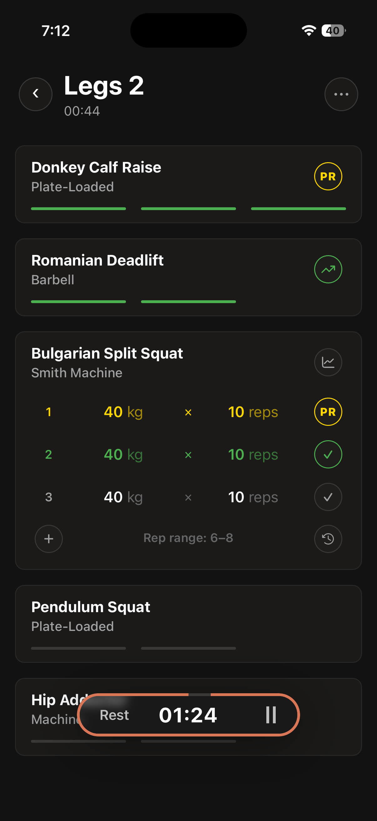 An active Crua workout: sets ticked off in two taps, a PR badge lit, rest timer running